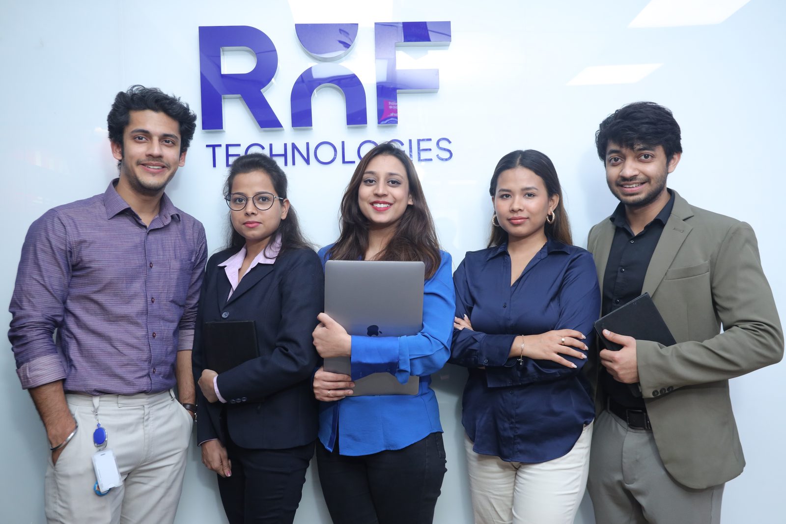 Colleagues at the RNF Technologies wall